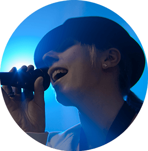 female rockstar singing onstage in the spotlight
